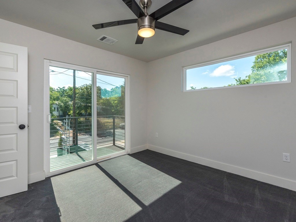 1182 Ridgeway Drive, Unit A Austin, TX 78702 - Photo 18 of 27 wooden floor in an empty room with a window