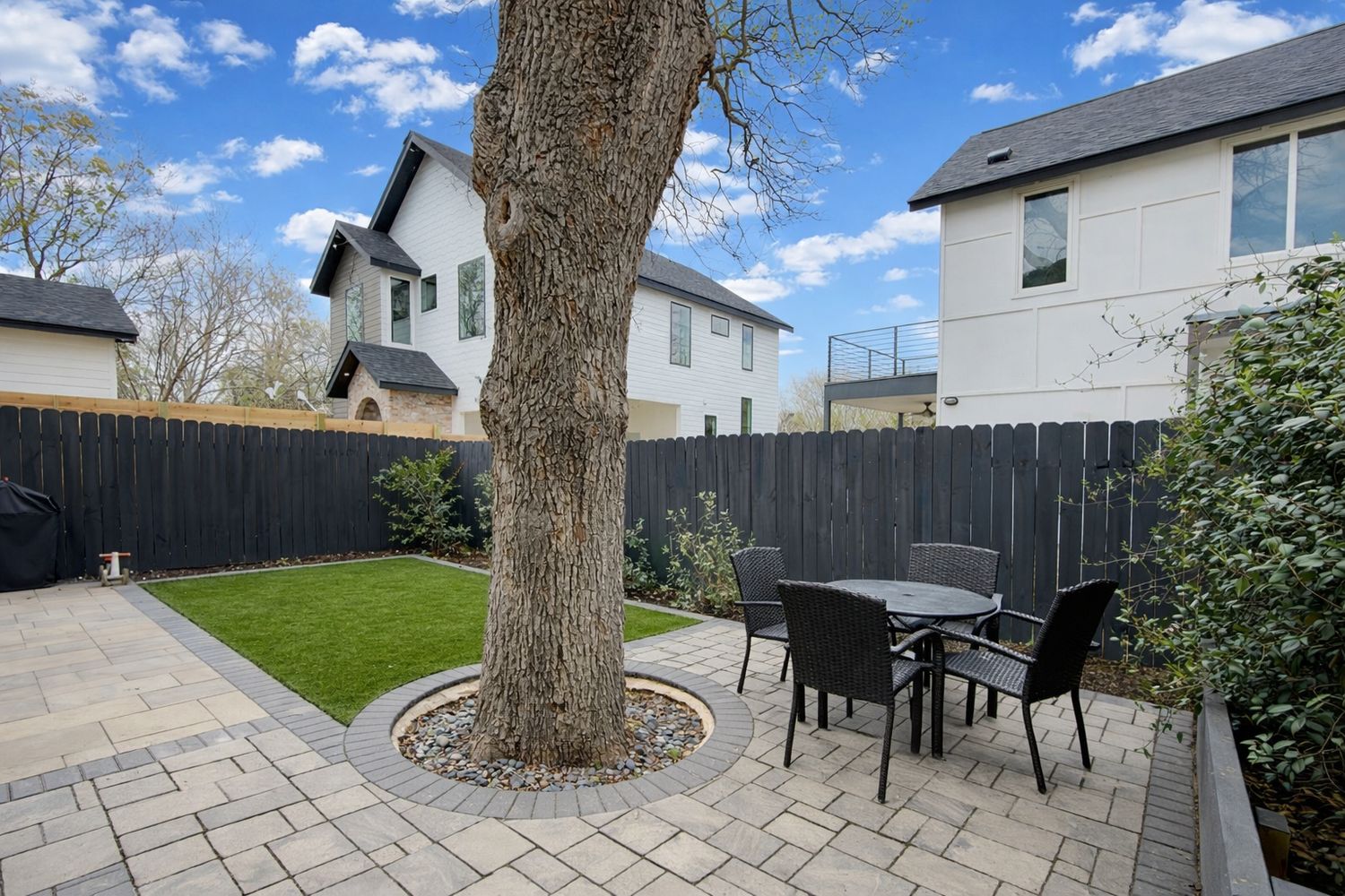 1182 Ridgeway Drive, Unit A Austin, TX 78702 - Photo 25 of 27 a view of a chairs and table in backyard