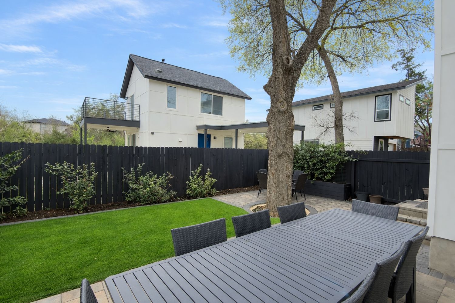1182 Ridgeway Drive, Unit A Austin, TX 78702 - Photo 26 of 27 a front view of a house with garden