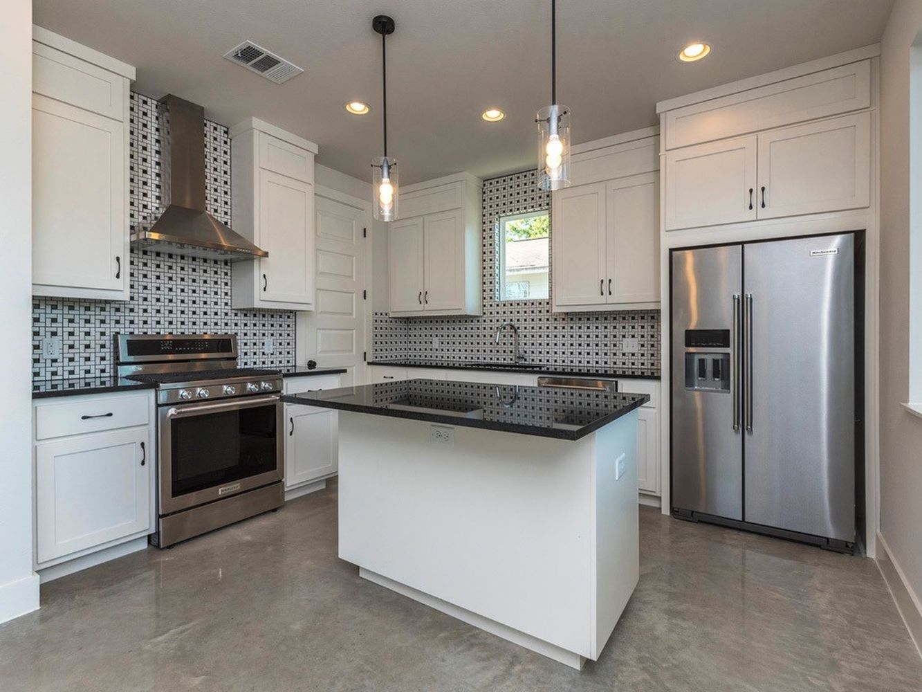 1182 Ridgeway Drive, Unit A Austin, TX 78702 - Photo 8 of 27 a kitchen with stainless steel appliances granite countertop a sink stove and refrigerator