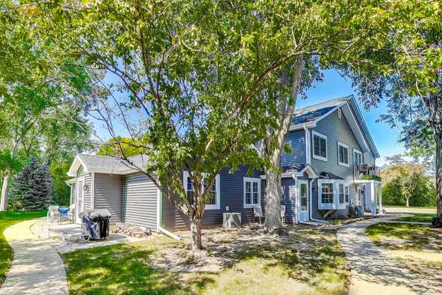 a house with trees in the background