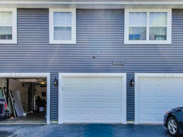 a view of a house with wooden deck