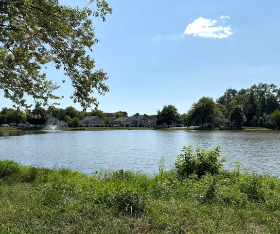 a view of lake with green space