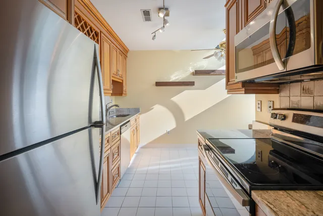 a view of a kitchen with furniture and a stove