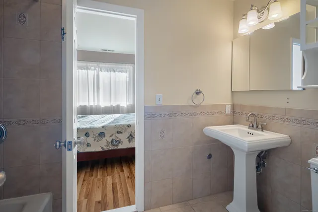 a bathroom with a sink and a mirror