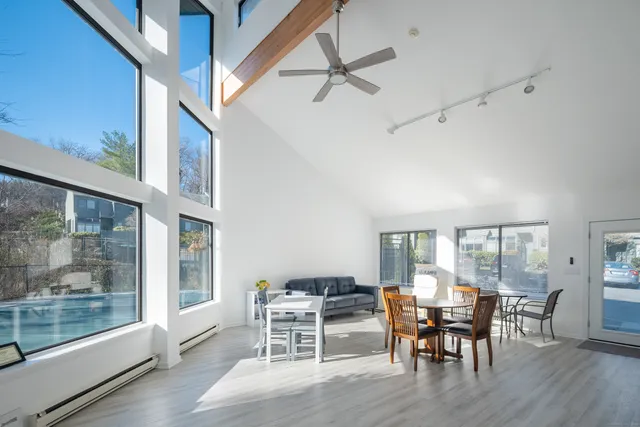 a view of a dining room with furniture window and wooden floor