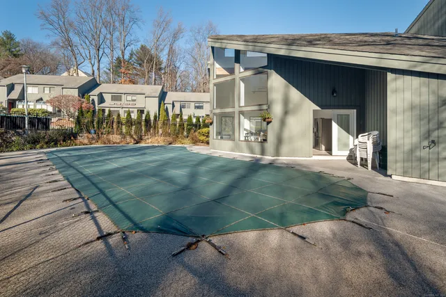 a view of a large building with a yard