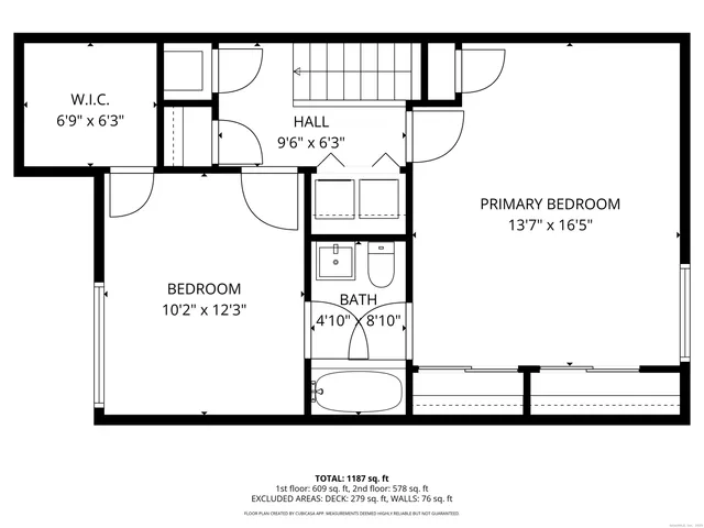 a picture of a bench in front of a gate
