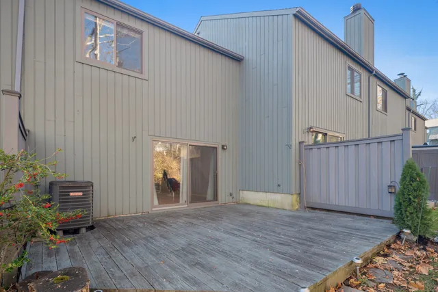 a view of a house with backyard and wooden floor