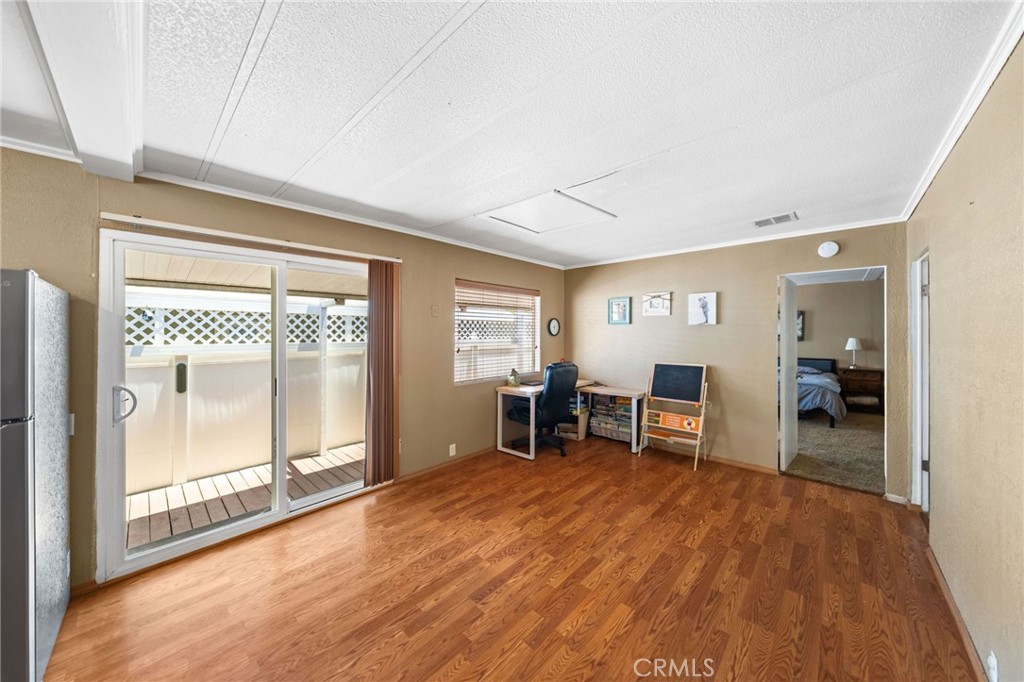 26311 Jackson Avenue, Unit 35 Murrieta, CA 92563 - Photo 11 of 41 a view of a room with furniture and windows
