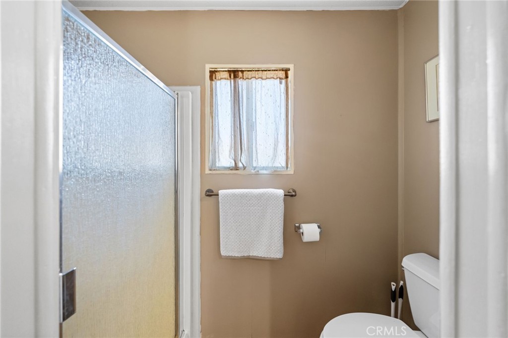 26311 Jackson Avenue, Unit 35 Murrieta, CA 92563 - Photo 16 of 41 a bathroom with a toilet sink and mirror