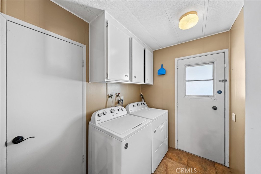 26311 Jackson Avenue, Unit 35 Murrieta, CA 92563 - Photo 23 of 41 a utility room with a sink a washer and dryer