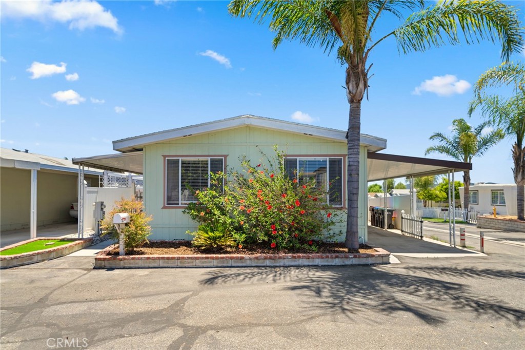 26311 Jackson Avenue, Unit 35 Murrieta, CA 92563 - Photo 31 of 41 a front view of a house with garden
