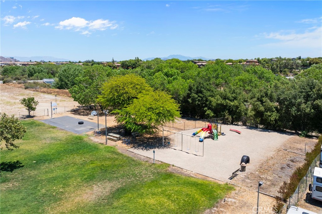 26311 Jackson Avenue, Unit 35 Murrieta, CA 92563 - Photo 35 of 41 an aerial view of residential houses with outdoor space and trees