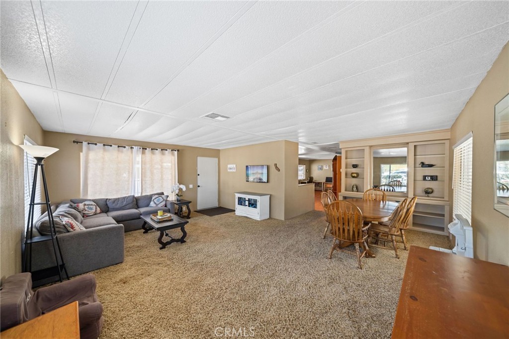 26311 Jackson Avenue, Unit 35 Murrieta, CA 92563 - Photo 4 of 41 a living room with furniture and a large window