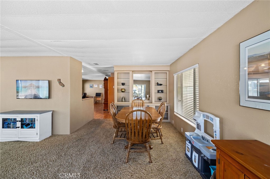 26311 Jackson Avenue, Unit 35 Murrieta, CA 92563 - Photo 6 of 41 a view of a livingroom with furniture and windows
