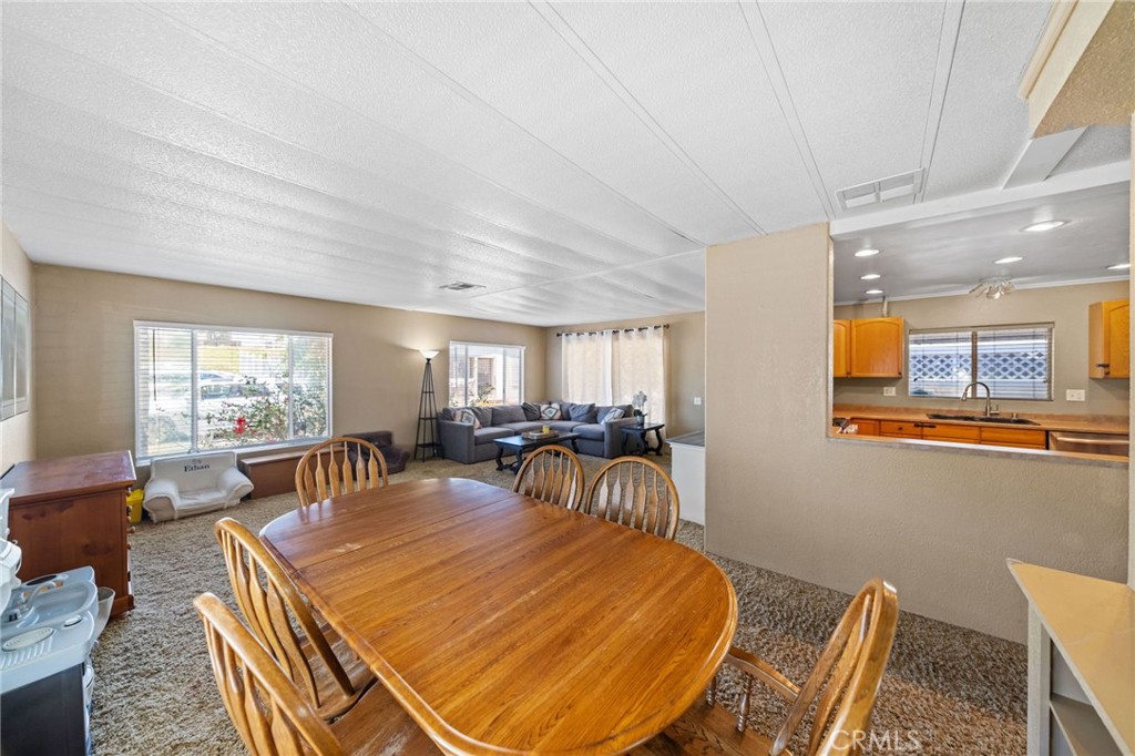 26311 Jackson Avenue, Unit 35 Murrieta, CA 92563 - Photo 7 of 41 a view of a dining room with furniture window and outside view