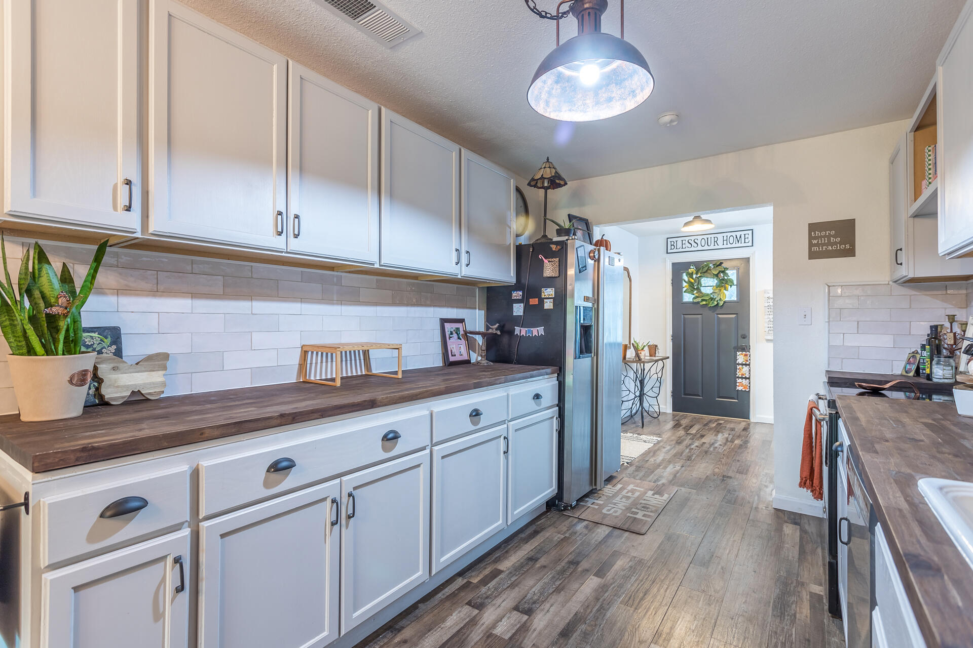 1115 Layton Road Redding, CA 96002 - Photo 13 of 26 a kitchen with granite countertop cabinets a sink and stainless steel appliances