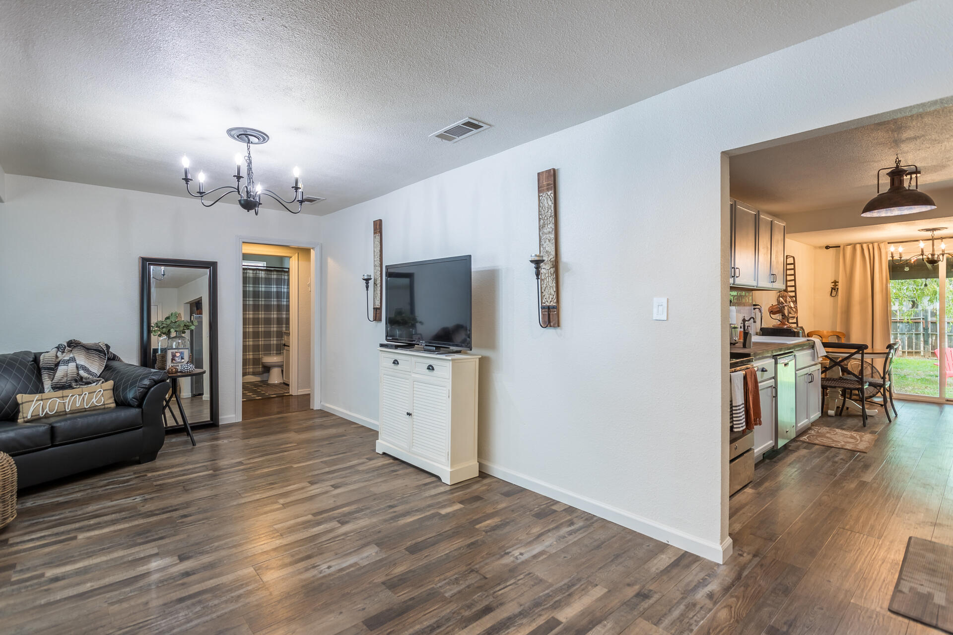 1115 Layton Road Redding, CA 96002 - Photo 6 of 26 a view of a livingroom with kitchen and furniture