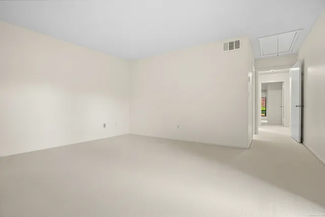 an empty room with closet area