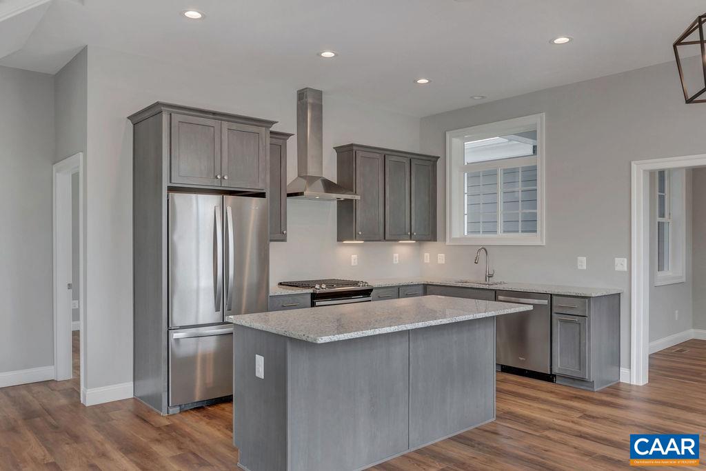 2262 Locust Hollow Road Charlottesville, VA 22903 - Photo 5 of 5 a kitchen that has a sink a refrigerator and cabinets