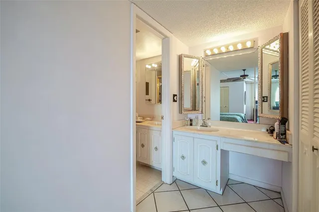a spacious bathroom with a double vanity sink mirror and a