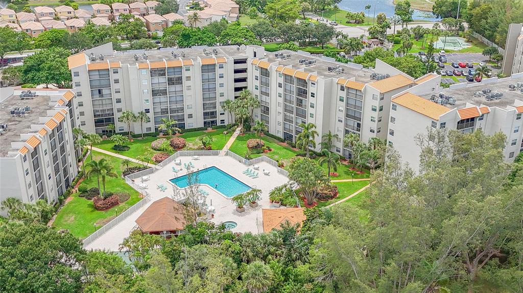 3910 Inverrary Boulevard, Unit 805B Lauderhill, FL 33319 - Photo 21 of 38 an aerial view of a house with a yard and lake view