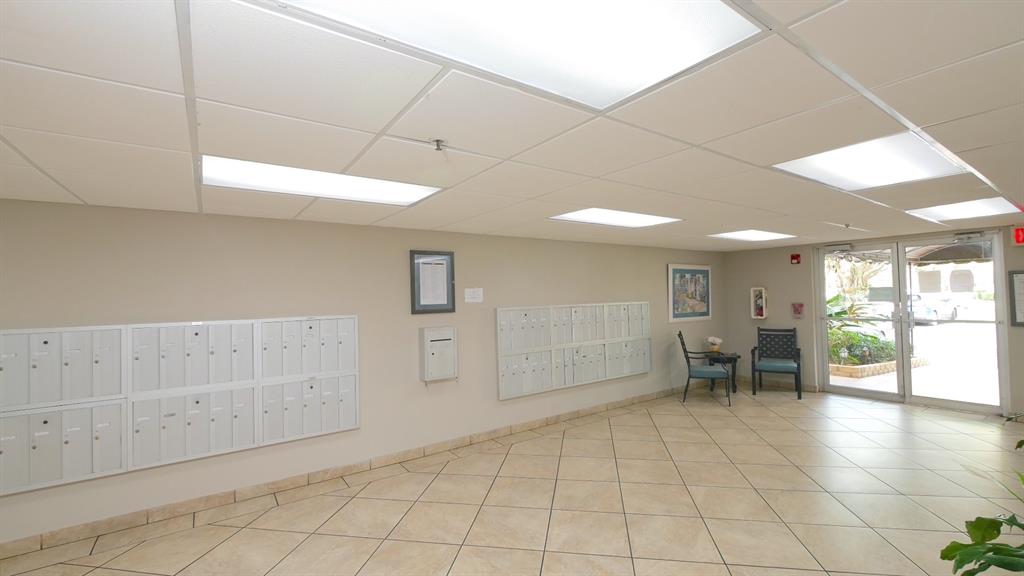 3910 Inverrary Boulevard, Unit 805B Lauderhill, FL 33319 - Photo 36 of 38 an empty room with cabinet and view of bathroom