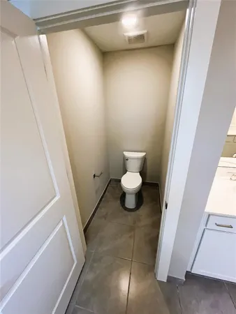 a view of a bathroom with a sink and a mirror