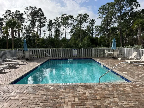 a view of a swimming pool with a patio