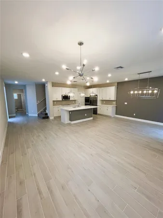 a view of a lobby with furniture and a chandelier
