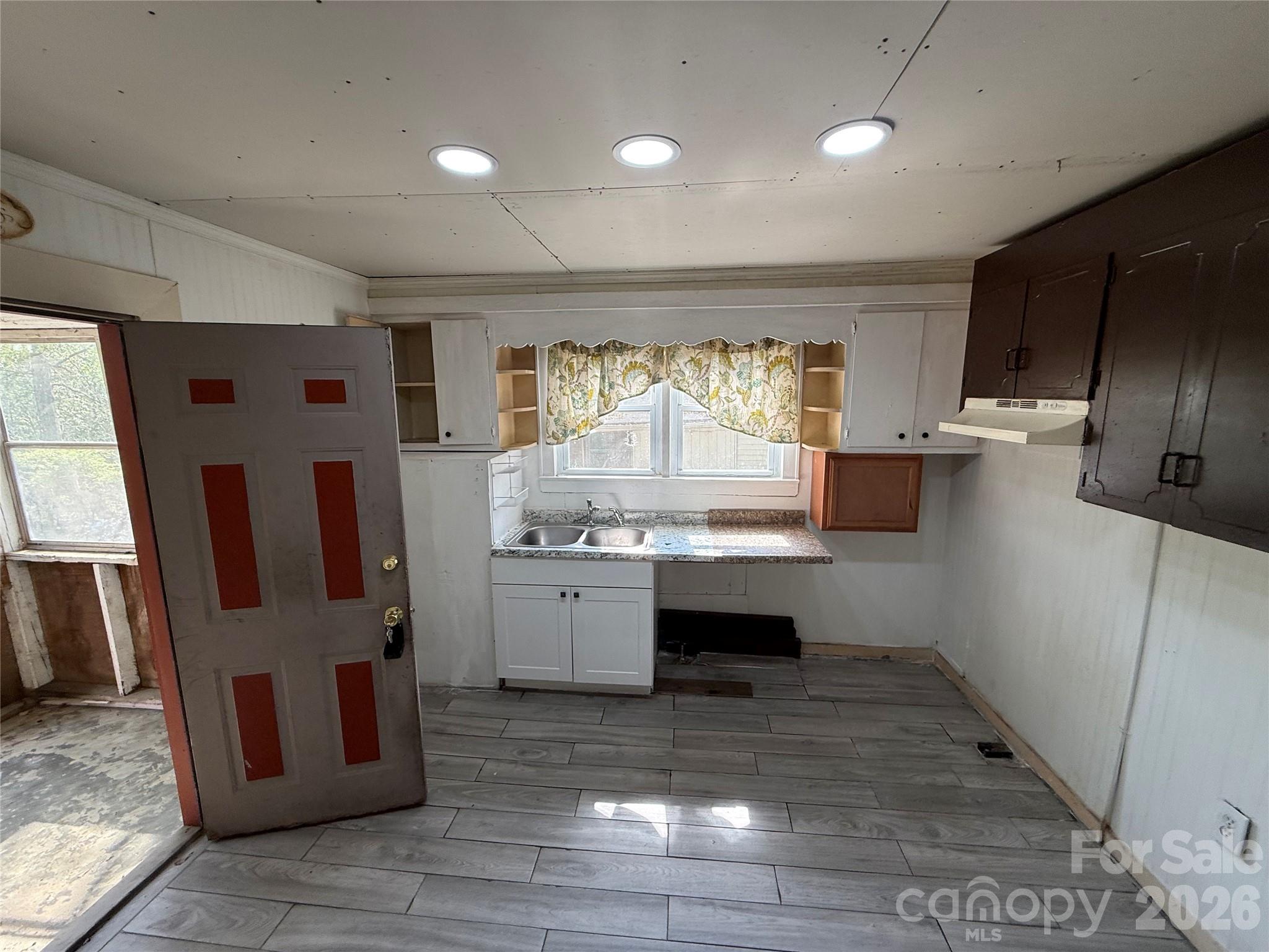 965 13th Street Lancaster, SC 29720 - Photo 9 of 17 a kitchen with stainless steel appliances kitchen island granite countertop a refrigerator and a stove