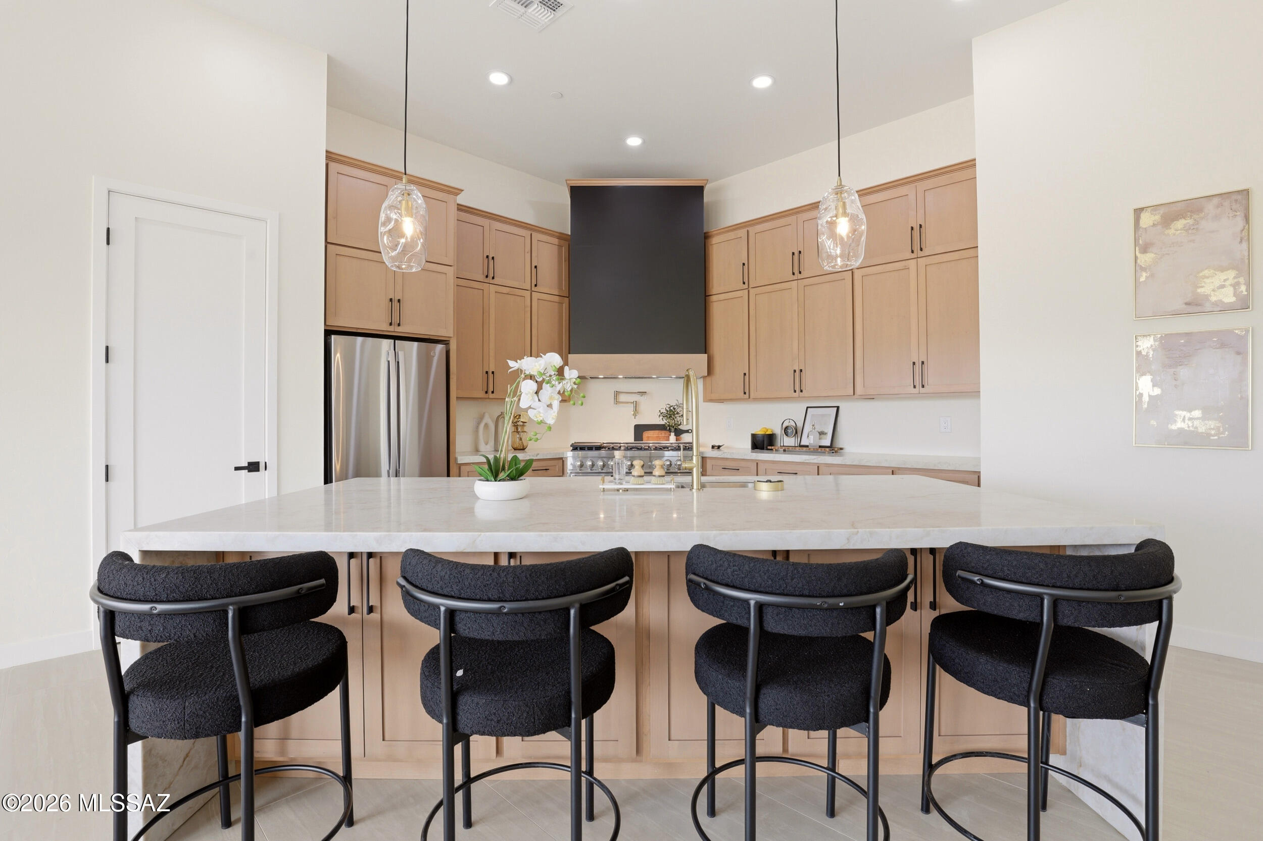 14527 East Sands Ranch Road Vail, AZ 85641 - Photo 7 of 48 a kitchen with a sink and chairs