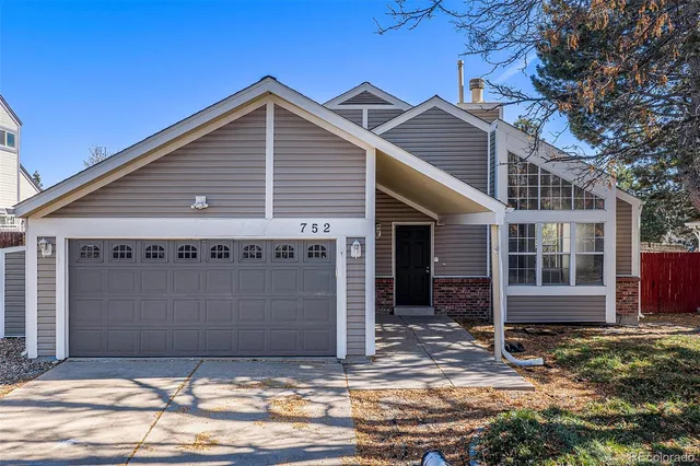 a view of a house with a garage