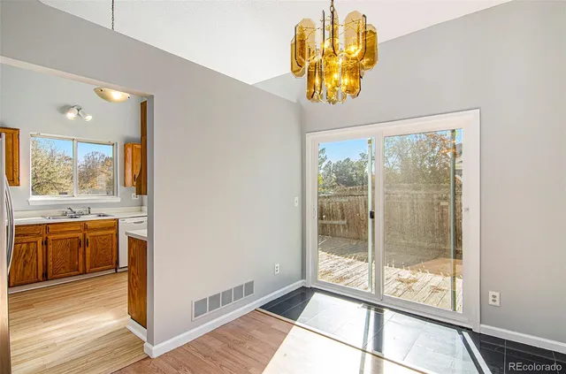 a kitchen with stainless steel appliances a refrigerator a stove a sink and dishwasher