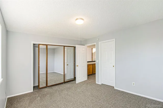 an empty room with a bathroom