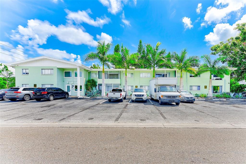 1329 Drew Street, Unit 8 Clearwater, FL 33755 - Photo 17 of 19 a view of a cars park in front of a building