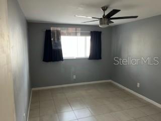 1329 Drew Street, Unit 8 Clearwater, FL 33755 - Photo 5 of 19 a view of a livingroom with a ceiling fan and a window