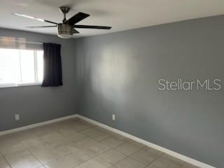 1329 Drew Street, Unit 8 Clearwater, FL 33755 - Photo 6 of 19 an empty room with a window and a fan