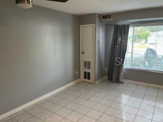 1329 Drew Street, Unit 8 Clearwater, FL 33755 - Photo 7 of 19 an empty room with windows