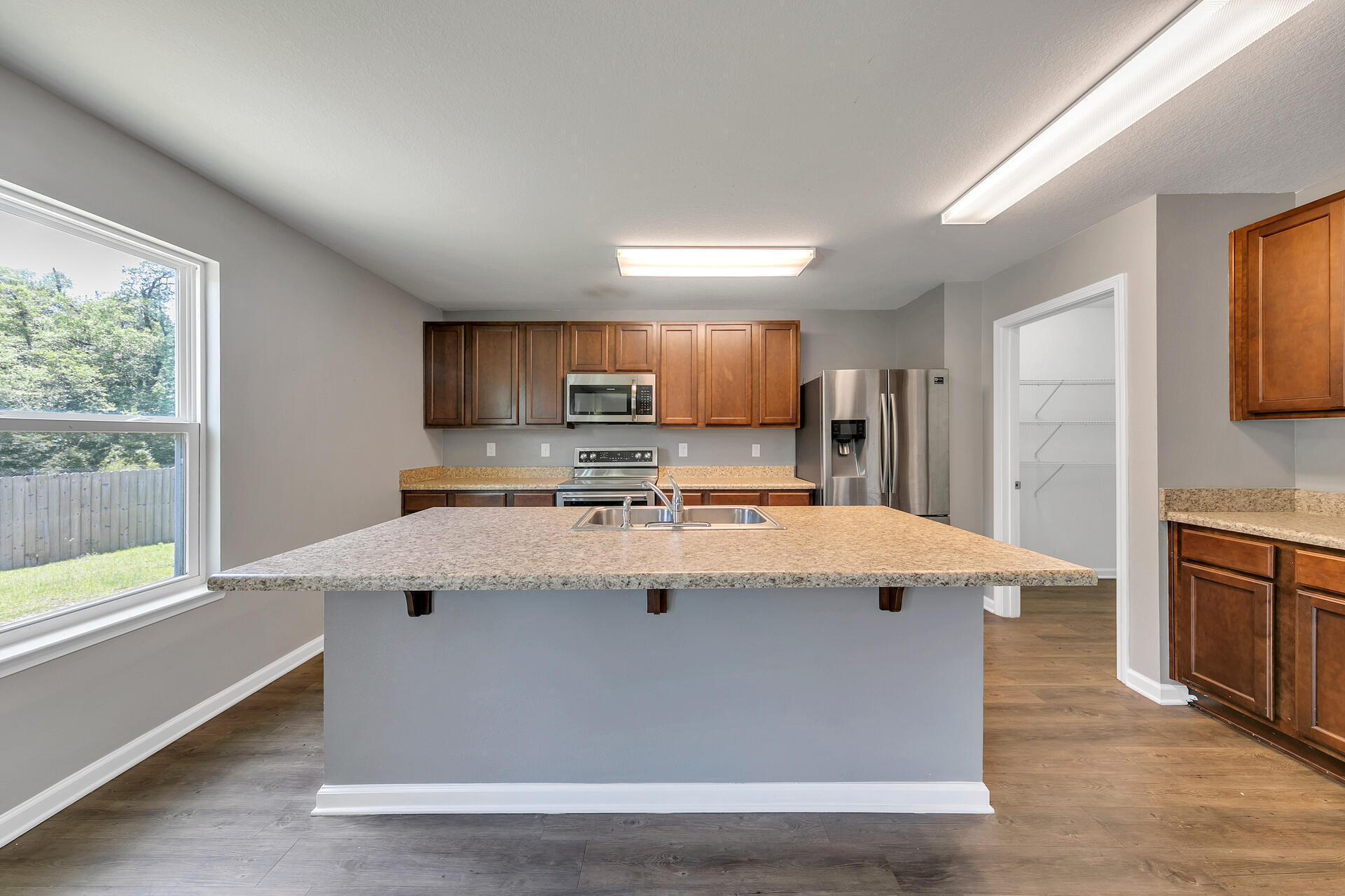 4624 Plover Drive Crestview, FL 32539 - Photo 11 of 34 a view of kitchen with wooden floor