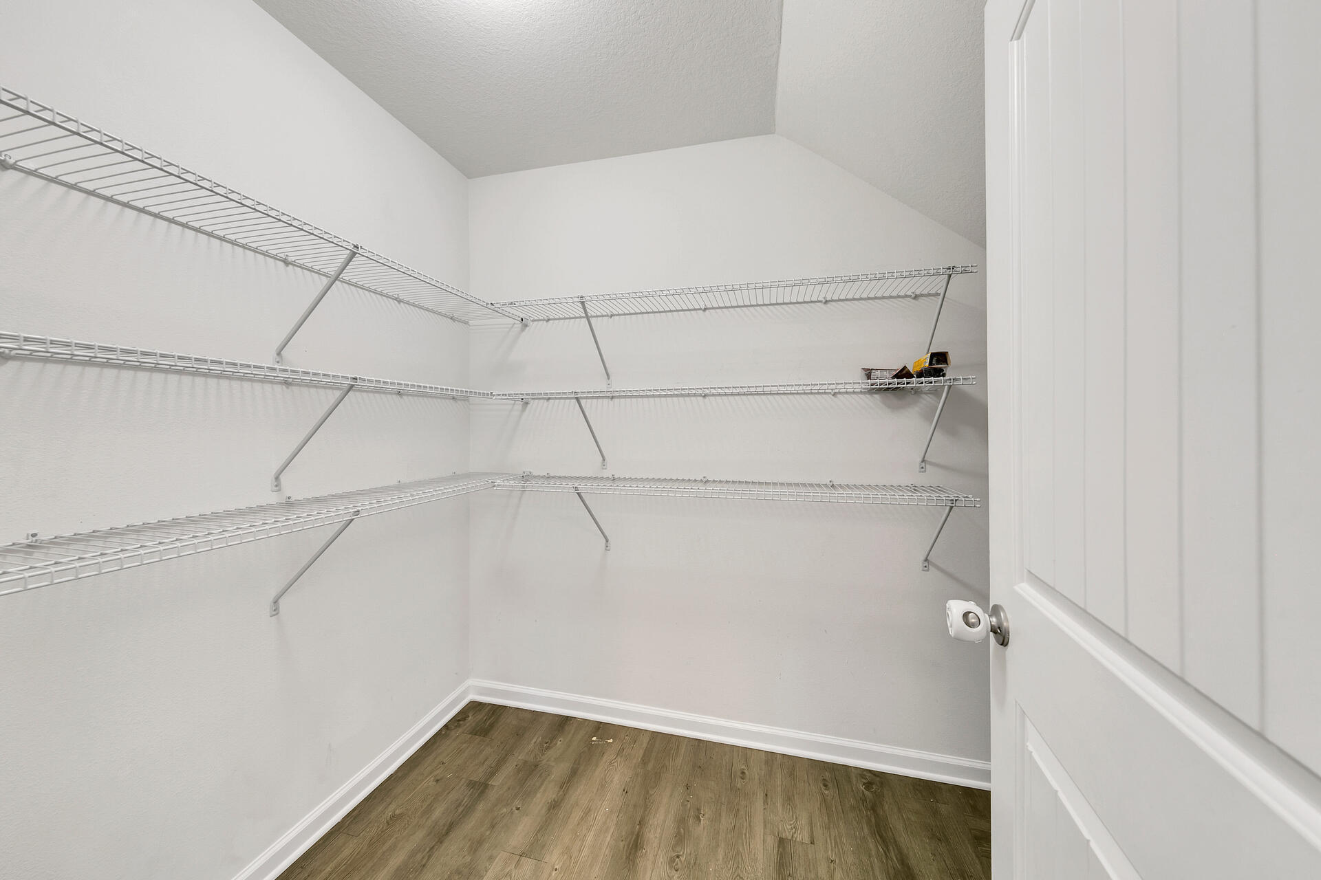 4624 Plover Drive Crestview, FL 32539 - Photo 14 of 34 a view of a room with racks on the wall