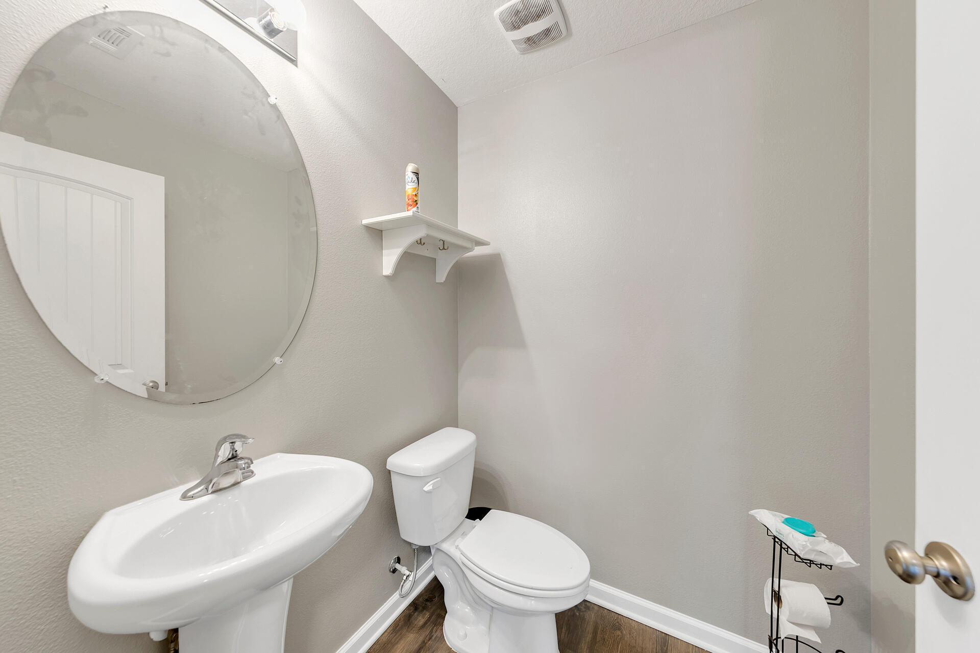 4624 Plover Drive Crestview, FL 32539 - Photo 15 of 34 a white toilet sitting next to a bathroom sink