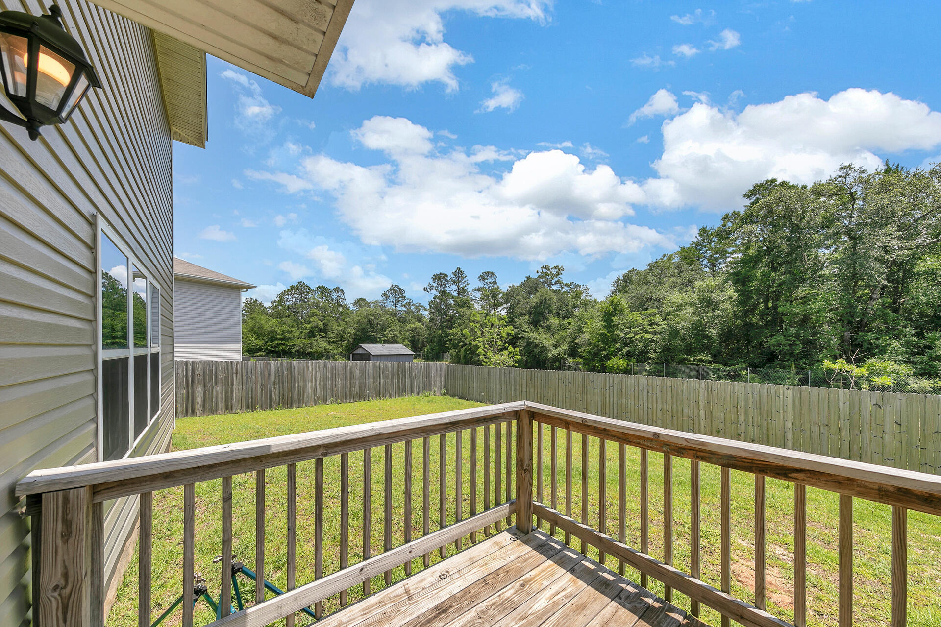 4624 Plover Drive Crestview, FL 32539 - Photo 16 of 34 a view of balcony with wooden floor
