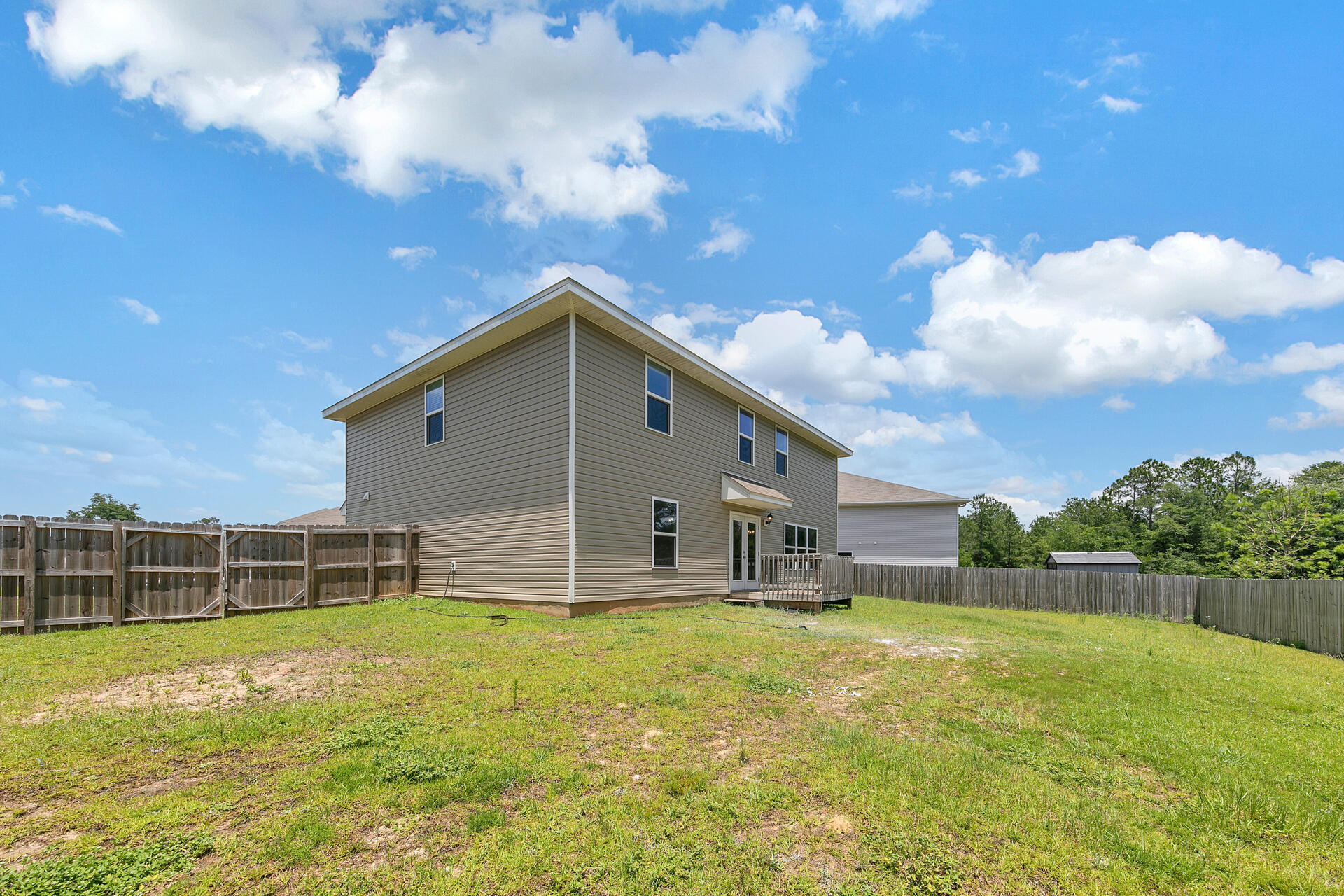 4624 Plover Drive Crestview, FL 32539 - Photo 19 of 34 a front view of a house with garden