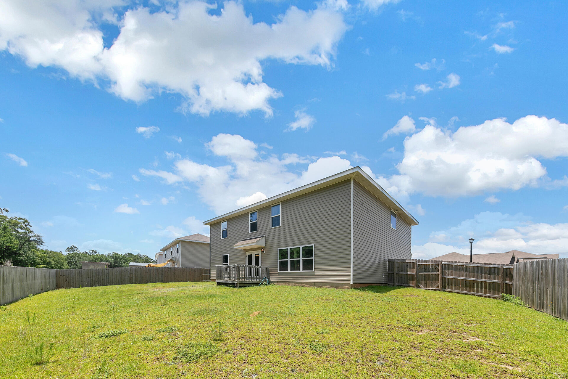 4624 Plover Drive Crestview, FL 32539 - Photo 20 of 34 a view of a house with a yard