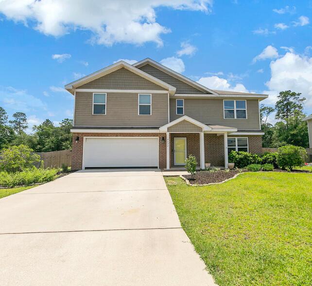 4624 Plover Drive Crestview, FL 32539 - Photo 2 of 34 a front view of a house with yard