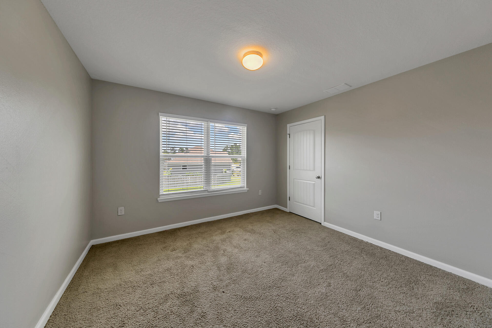 4624 Plover Drive Crestview, FL 32539 - Photo 21 of 34 a view of an empty room with a window