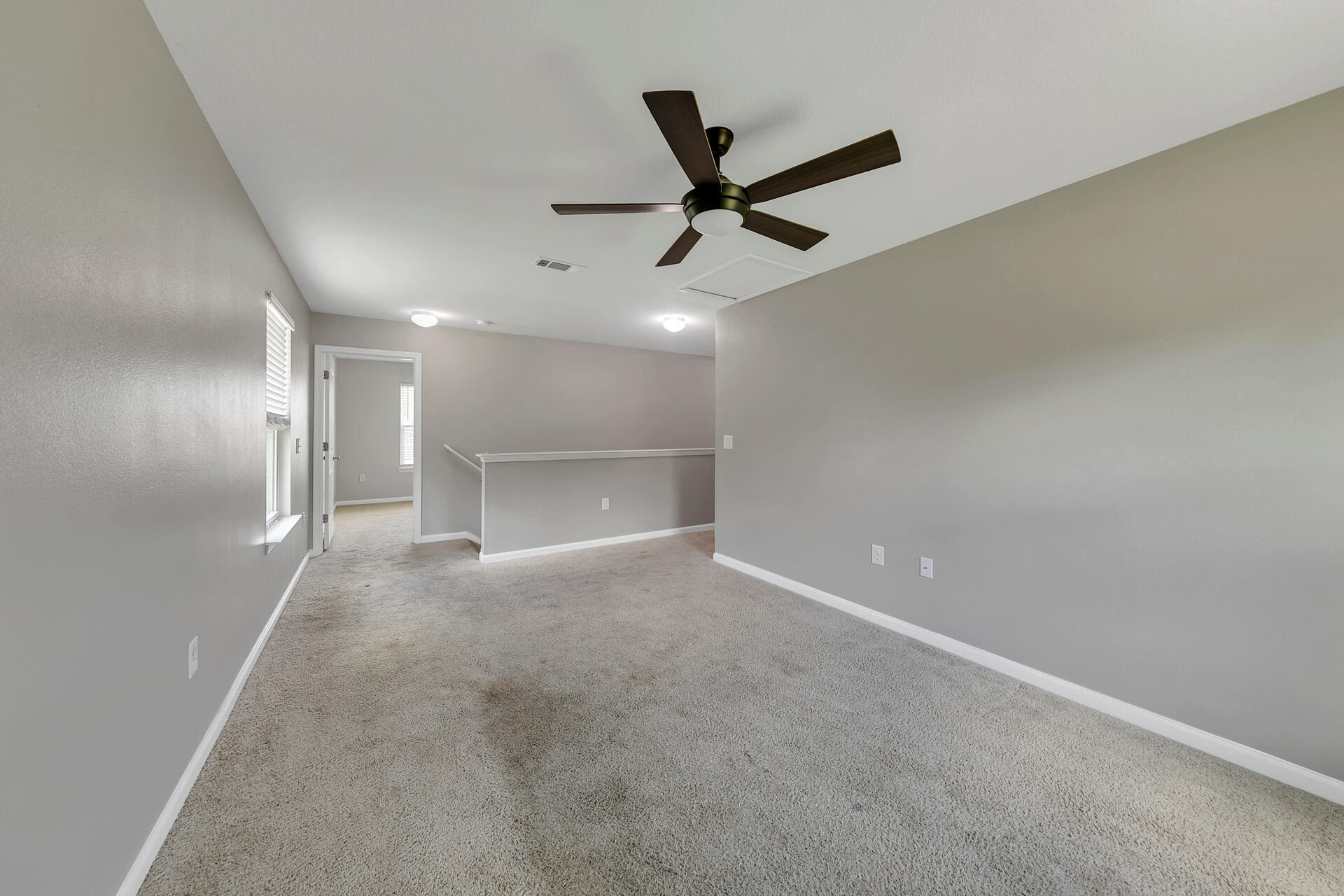 4624 Plover Drive Crestview, FL 32539 - Photo 23 of 34 an empty room with closet and windows
