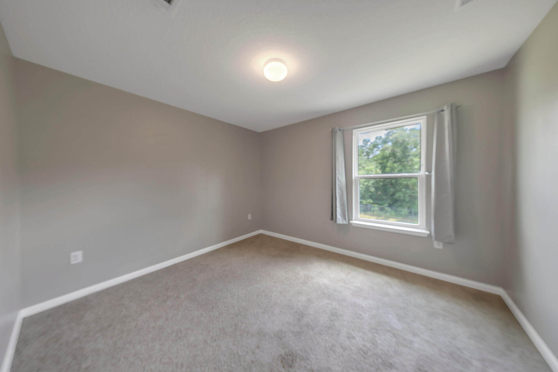 4624 Plover Drive Crestview, FL 32539 - Photo 25 of 34 an empty room with a window